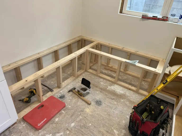 Timber framing for the L-shaped kitchen breakfast-nook bench.