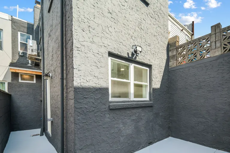 The rear courtyard and painted exterior